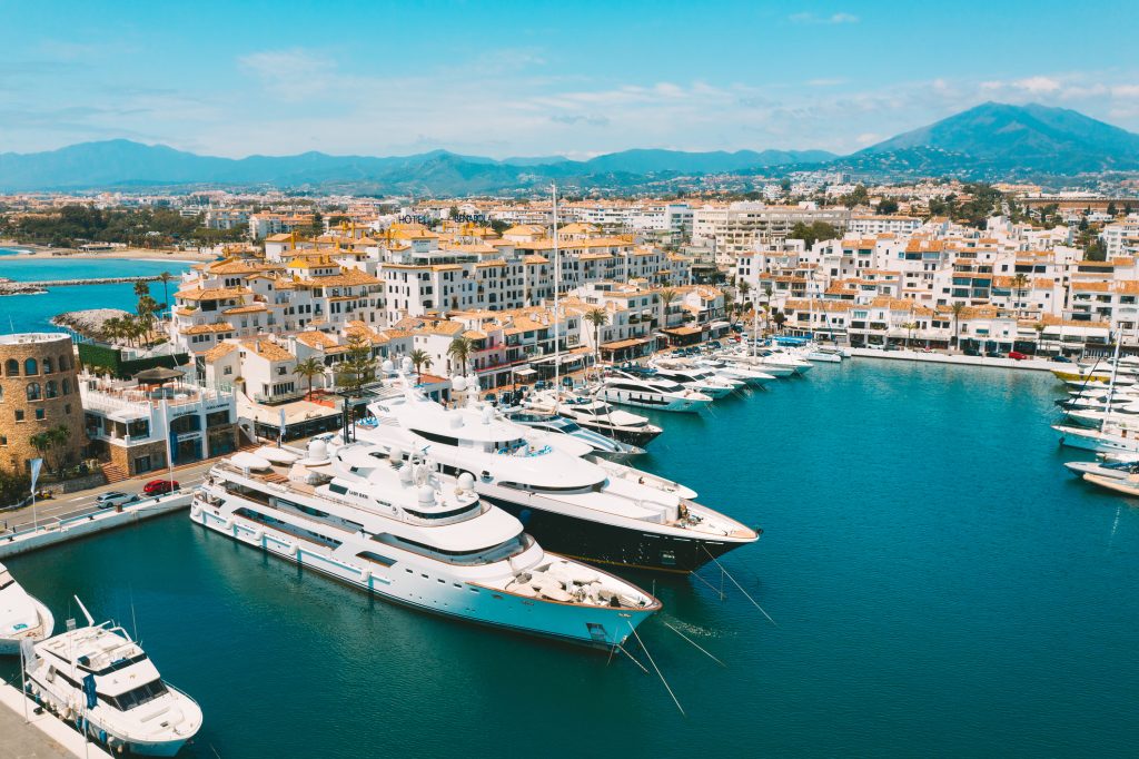Aerial top view of luxury yachts in Puerto Banus marina, Marbella, Spain. High quality photo - Accent On Travel