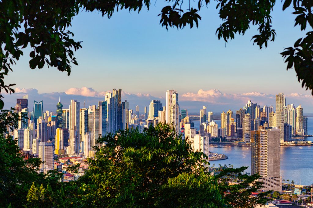View of the skyline of Panama City framed by tropical rain forest - Accent on Travel
